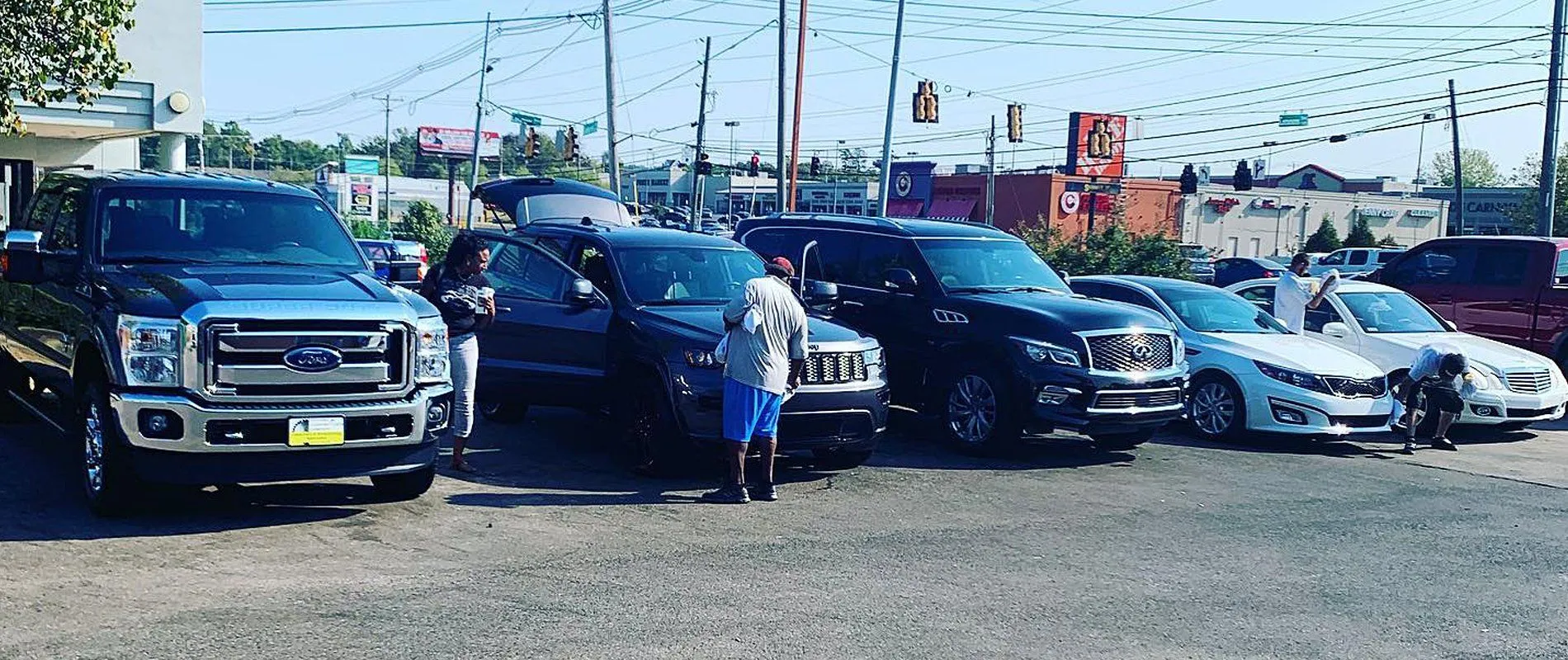 Several vehicles being washed and detailed on the Hamilton Place lot on Gunbarrel Road